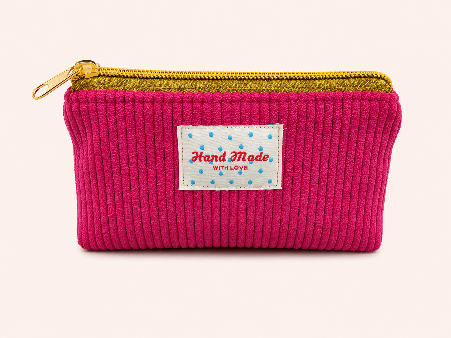 La mini pochette fuchsia bloom